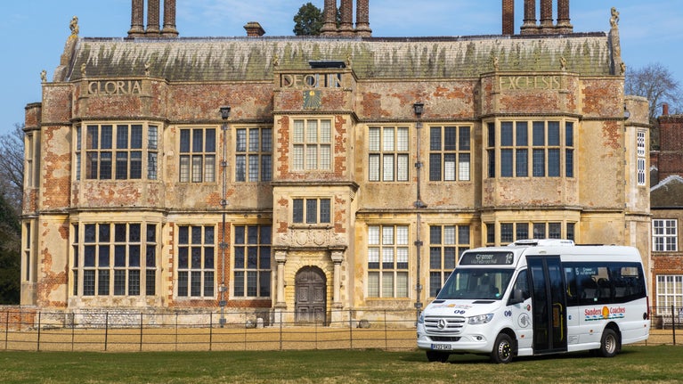 Sanders bus service in front of 17th century Felbrigg Hall